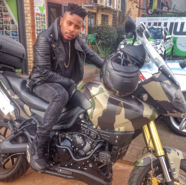L-Tido on a bike rocking black Air Jordan 1