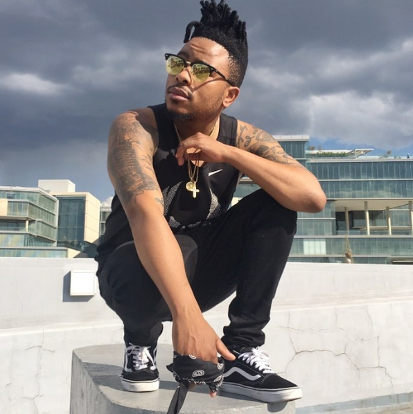 L-Tido rocking Vans Old Skool sneakers