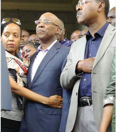 Jimmy Wanjigis wife Irene Nzisa clutches on her husband on Wednesday during a press conference