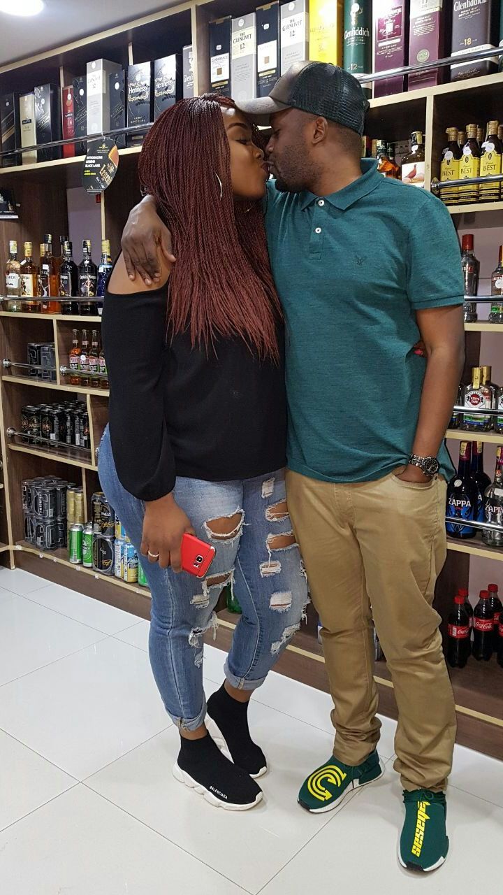Risper Faith kissing her fiance, Brian (Brayo) Muiruri