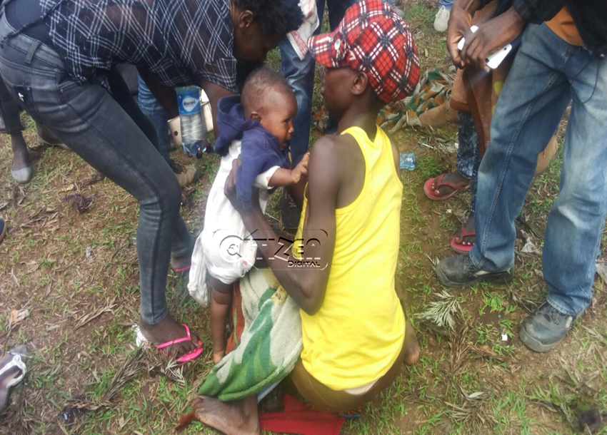 journalists helping mother and child