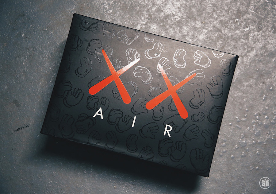 KAWS x Air Jordan 4 Black sneakers. photo credit: Sneaker News