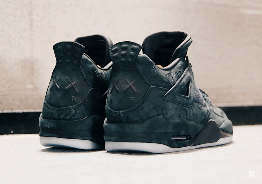 KAWS x Air Jordan 4 Black sneakers. photo credit: Sneaker News