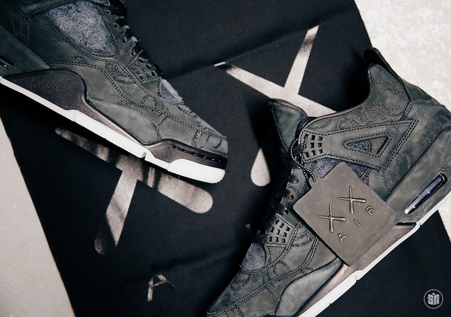 KAWS x Air Jordan 4 Black sneakers. photo credit: Sneaker News