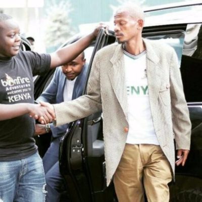 Boniface Mwangi clears his posters after loosing the Starehe Constituency post