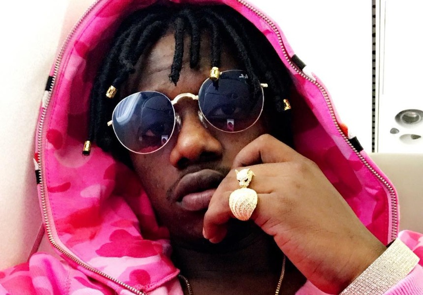 Rayvanny in pink in a new hair do dreads