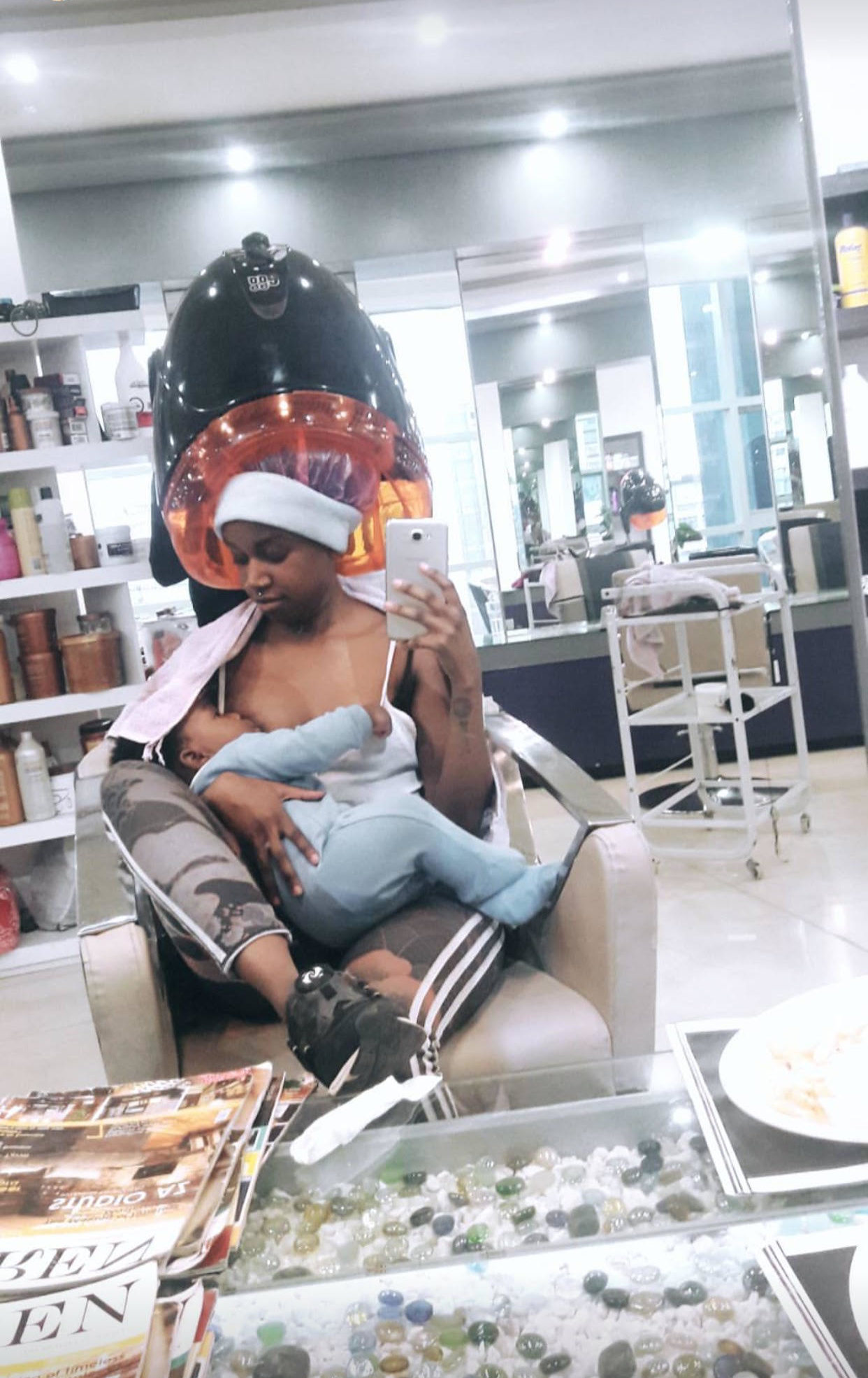 Former Camp Mulla singer Miss Karun breastfeeds her son at a salon