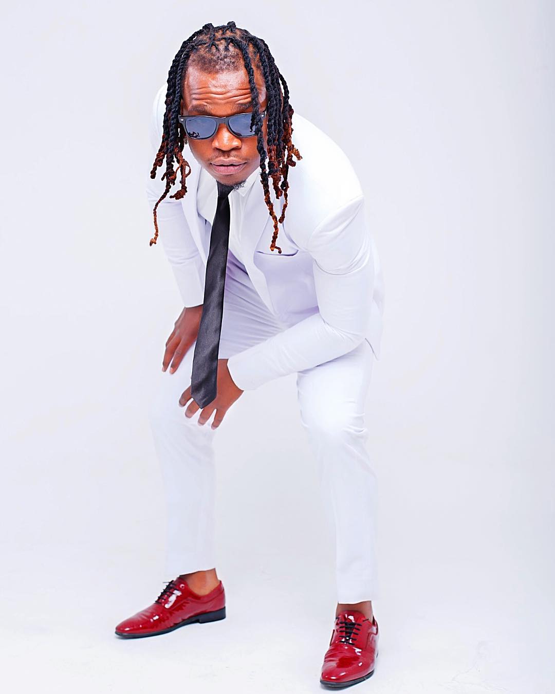 Timmy Tdat rocking a white suit. source: Instagram/timmytdat