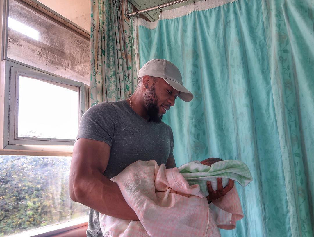 Frankie holding his new baby. photo credit: Instagram.frankie_justgymit