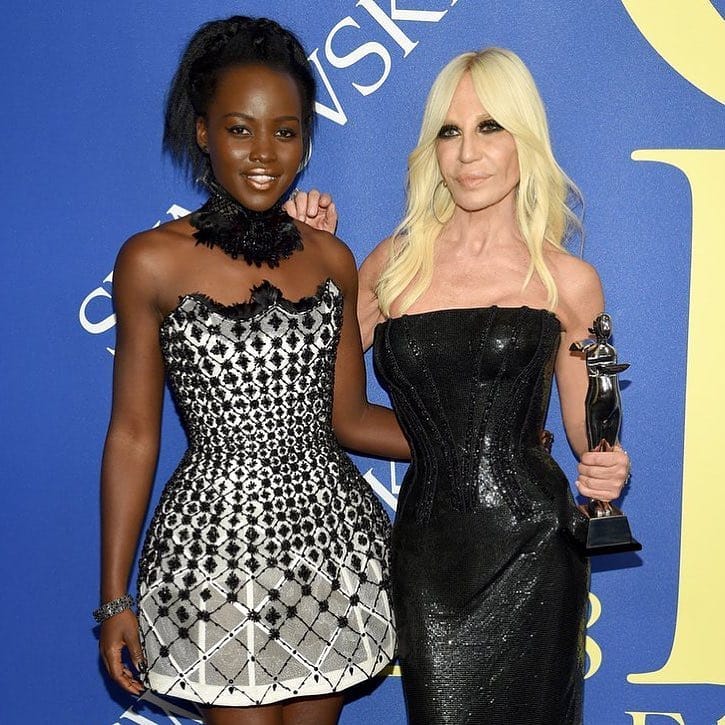 Lupita Nyong'o in a past event with vice president of the Versace Group, Donatella Versace holding her Council of Fashion Designers of America(CFDA) International Award. photo credit: Instagram/lupitanyongo