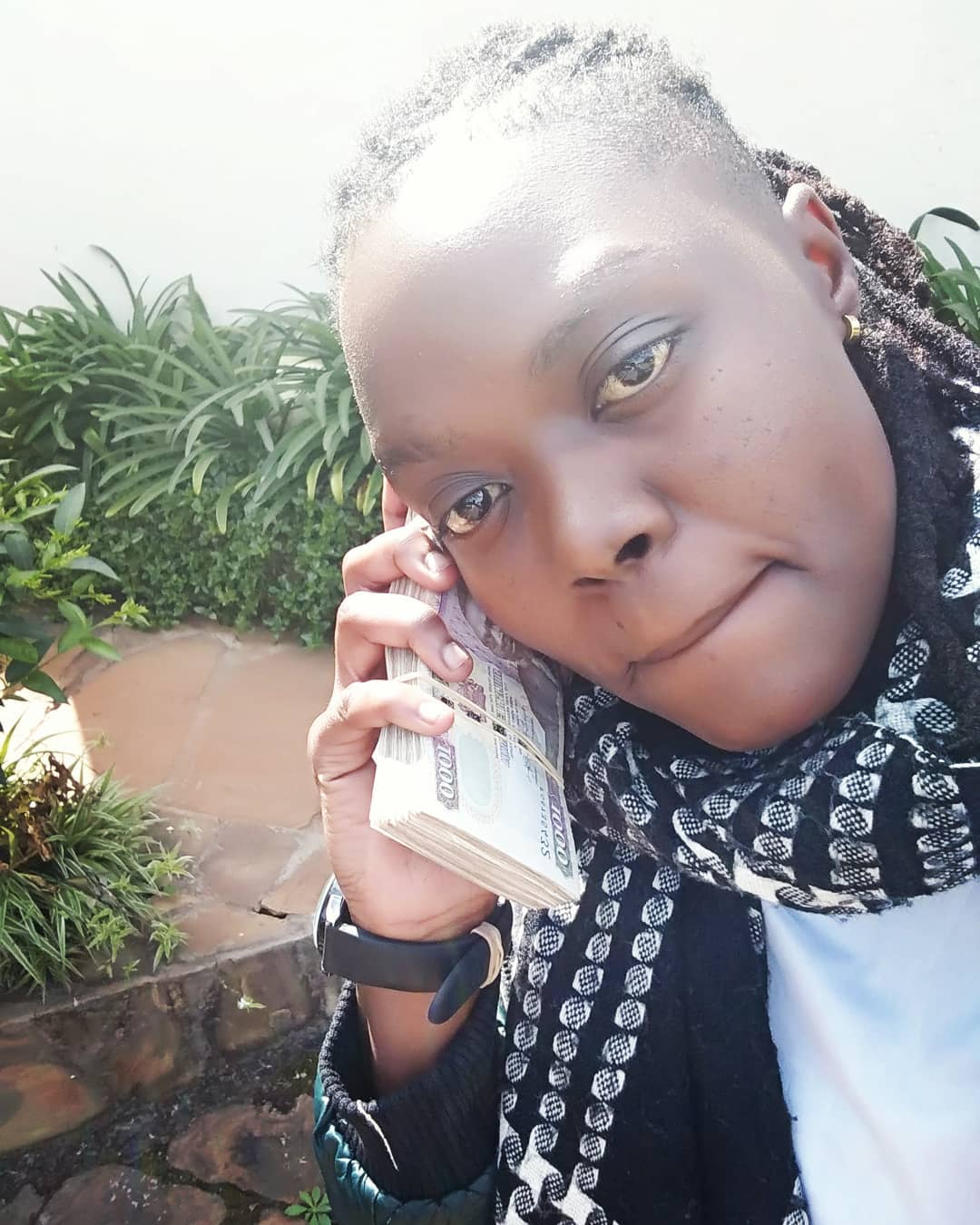 Lady Bud talking to the money. photo credit: Instagram/layd_bud
