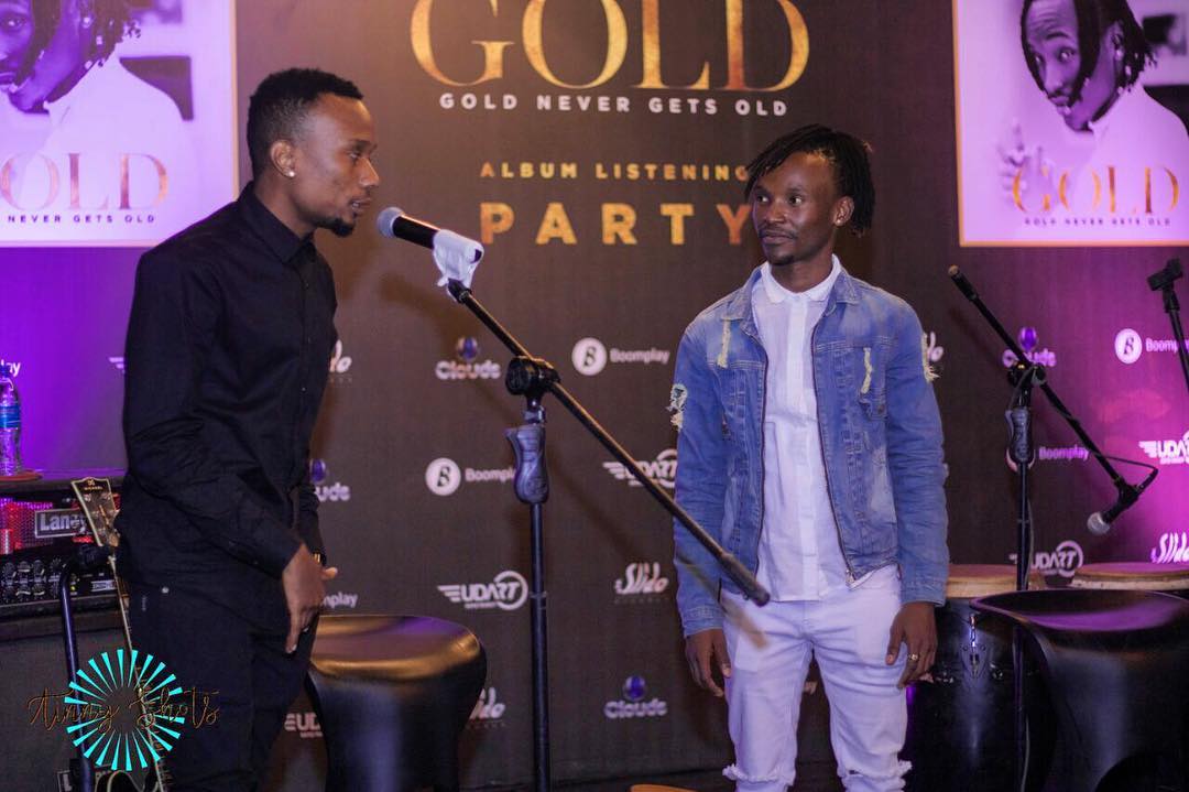 Barnaba looking on as Billnass is talking at the listening party