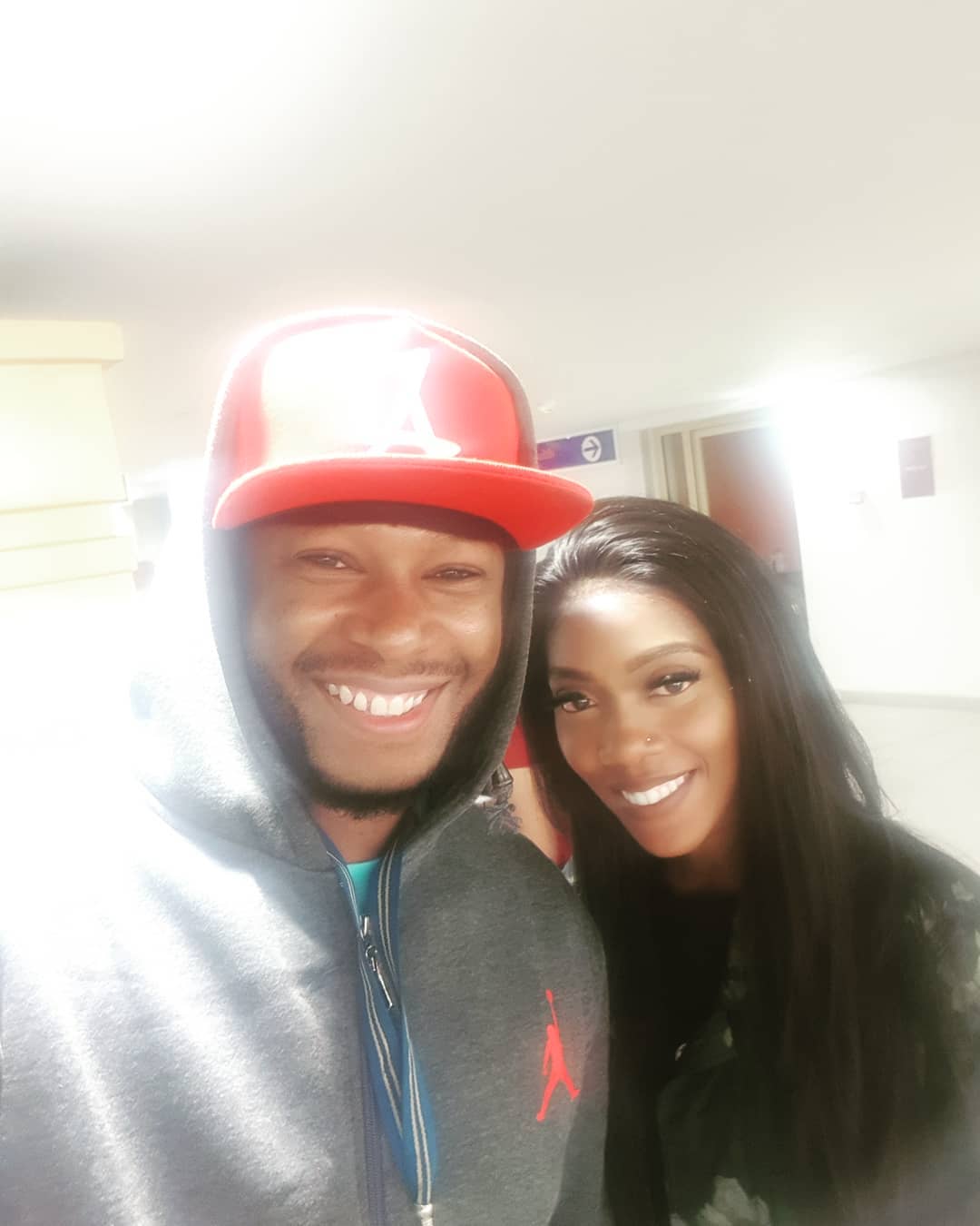 Redsan with Nigerian pop star, Tiwa Savage at the airport. photo credit: Instagram/anyikopr