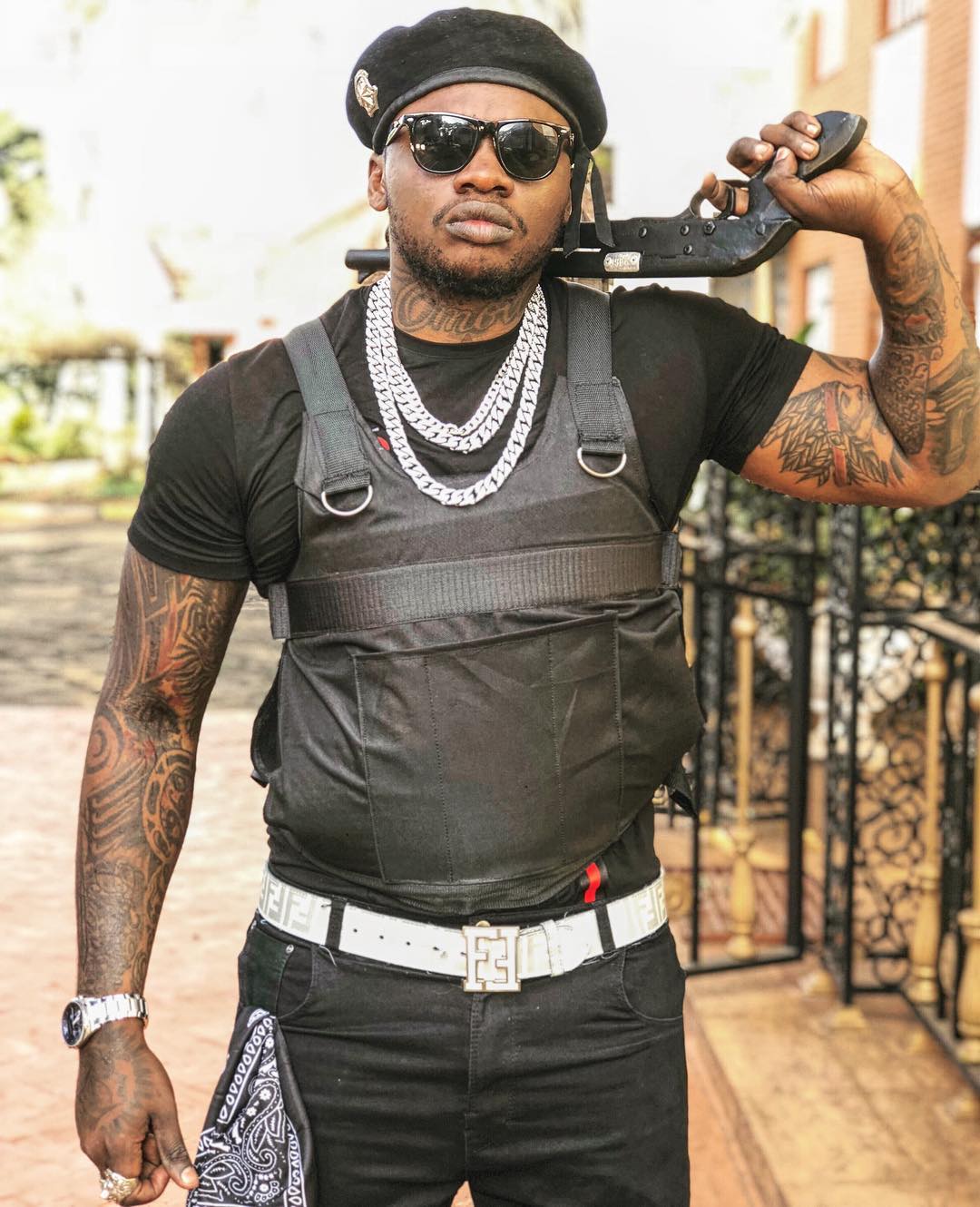 Khaligraph Jones is heavily tatted in almost every part of his arm, his chest with his neck with a tattoo reading "Omollo". photo credit: Instagram/khaligraph_jones