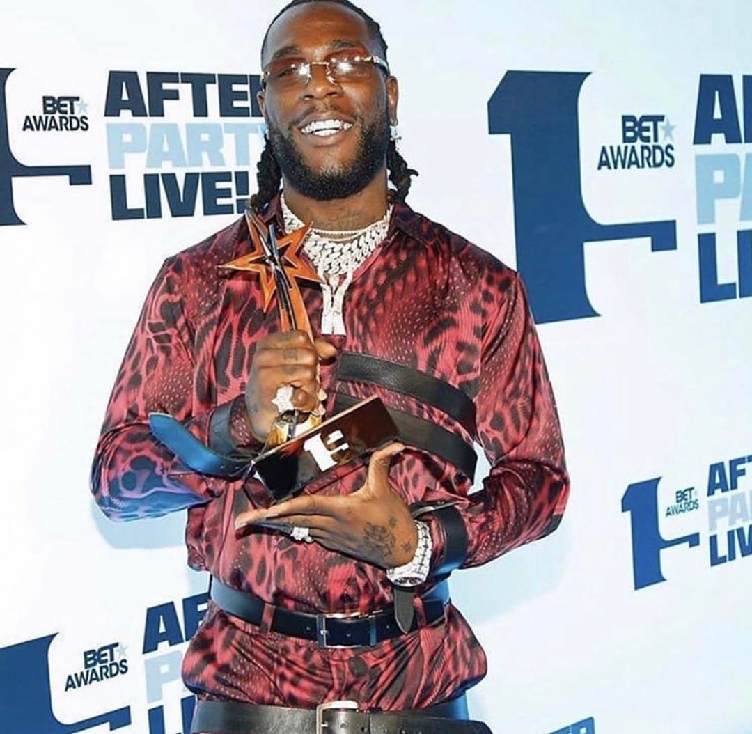 Burna Boy holding his BET Award in Los Angeles. photo credit: Instagram/davidoofficial