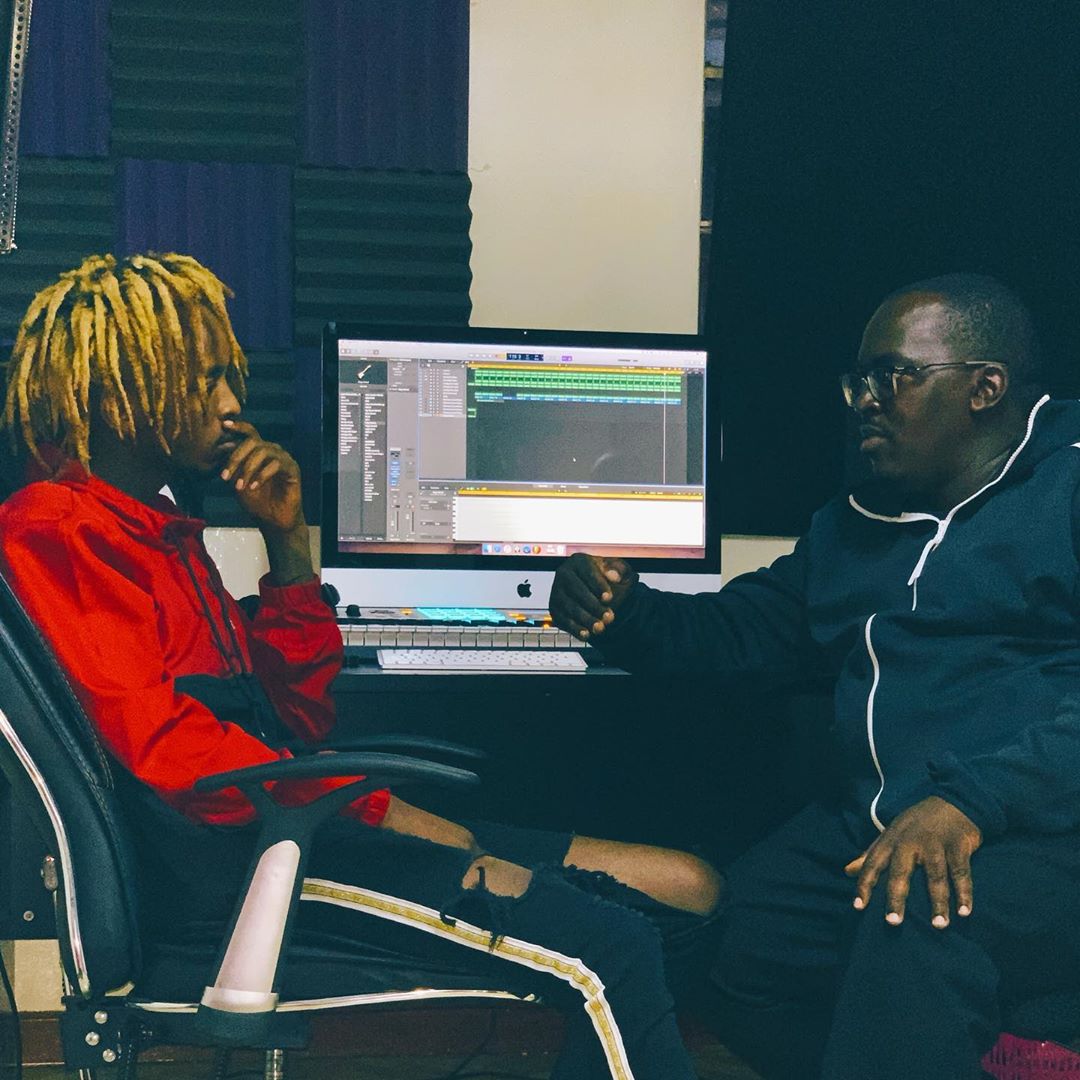 Magix Enga sitting down deliberating with Ngomma VAS Limited founder and boss, Clement "Clemmo" Rapudo in his Magix Empire studios about the pulling down Harmonize's hit song 'Uno' before it went live back on YouTube. photo credit: Instagram/magix_enga