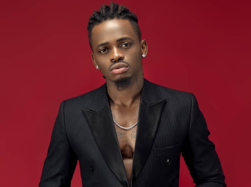 Diamond Platnumz in a black suit jacket without any tshirt