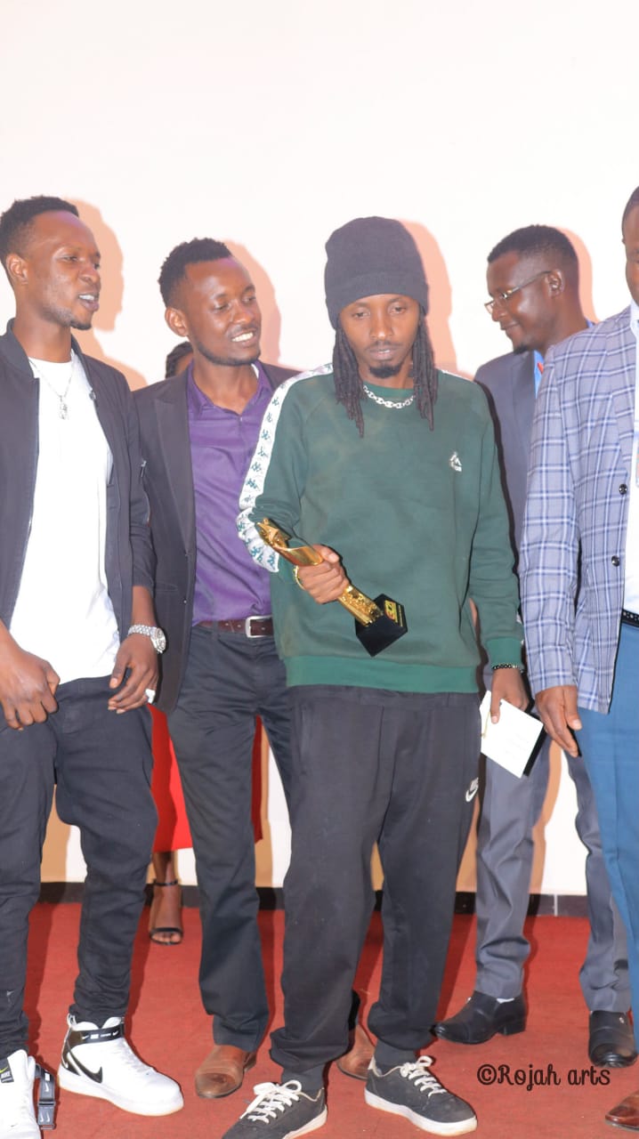 Smallz Lethal posing with the Gusii Creative Awards award that he won at Karmel Park, Kisii this past Tuesday. Photo credit: Instagram/smallzlethal