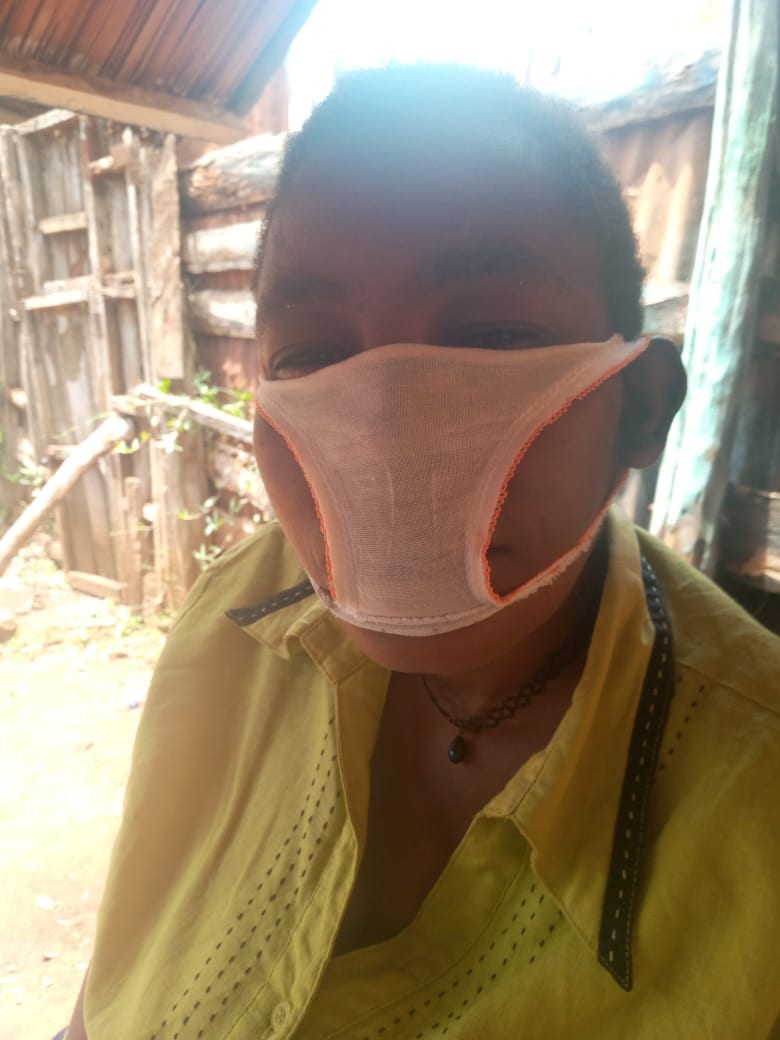 Mathare village resident wearing the "face mask" that he was sold to cut from women underwear. Photo credit: Moses Ngige