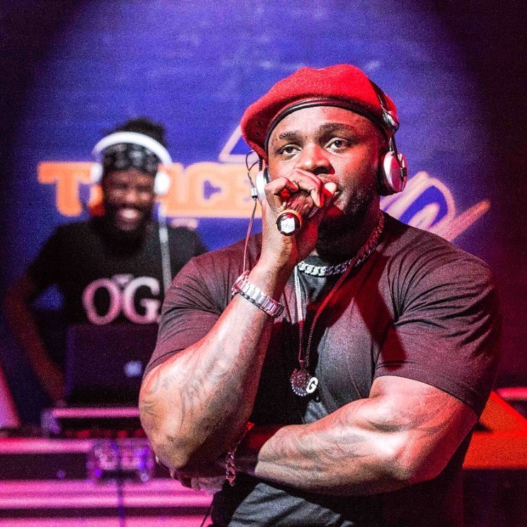 Khaligraph Jones on set of the Trace Live performance with his official DJ, ZJ Heno on the background. Photo credit: Instagram/khaligraph_jones