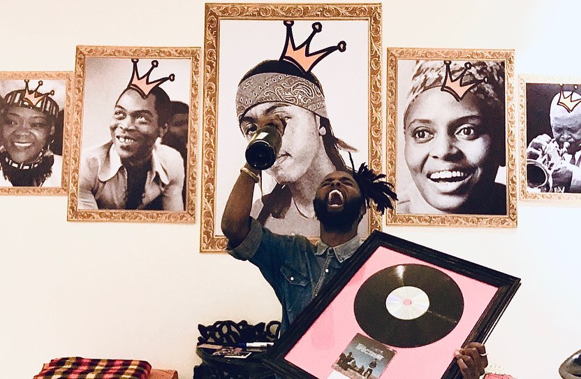 Kagwe Mungai holding his platinum plaque he got from his debut studio album 'Spectrum'. Photo credit: Instagram/kagwemungai