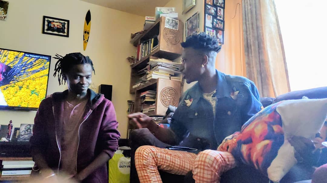 Juliani and Octopizzo having a debate about the Kenyan hip hop scene and how they played a major role in shaping it inside Boniface Mwangi's house. Photo credit: Instagram/bonifacemwangi