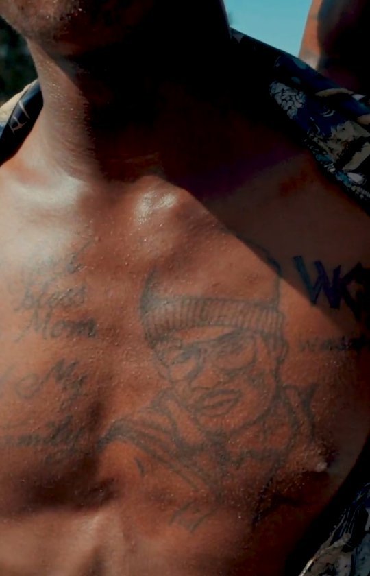 Fan displaying his Diamond Platnumz's portrait and WCB logo tattoo across his chest. Photo credit: Instagram/diamondplatnumz