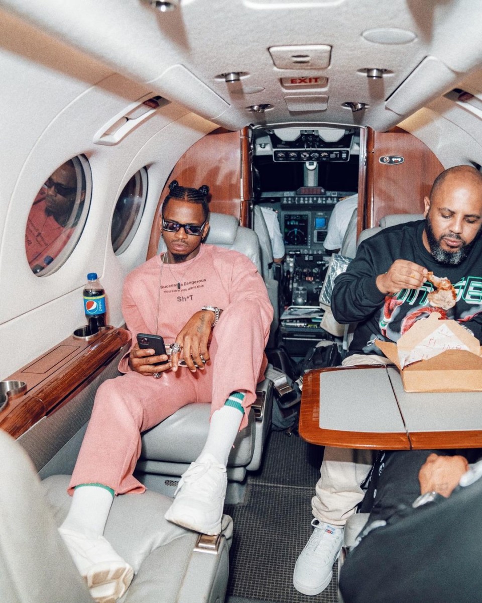 Diamond Platnumz and his manager Sallam SK Mendez aboard a private jet. They were flying from Nairobi to Dar es Salaam
