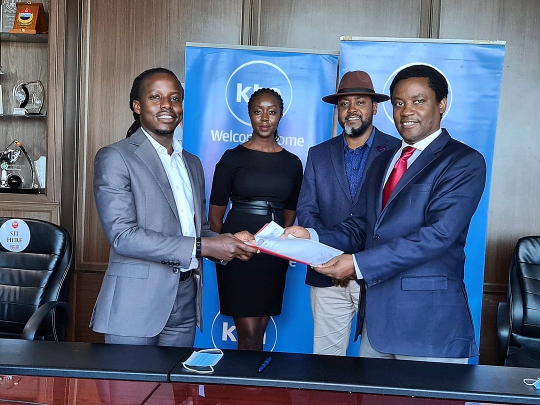 Eugene Mbugua (Left signing) Joe Munene Managing Director Broadcast Diivison The Standrad Group, Actor Mwaniki Mageria with the fedora cap and Caroline Wanjiru Production Manager Foods of Kenya