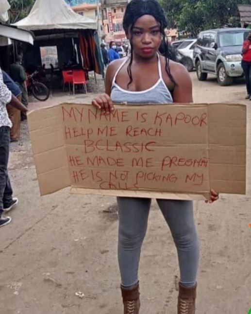 Kapoor holding the placard that tells the world how B Classic left her after allegedly impregnating her