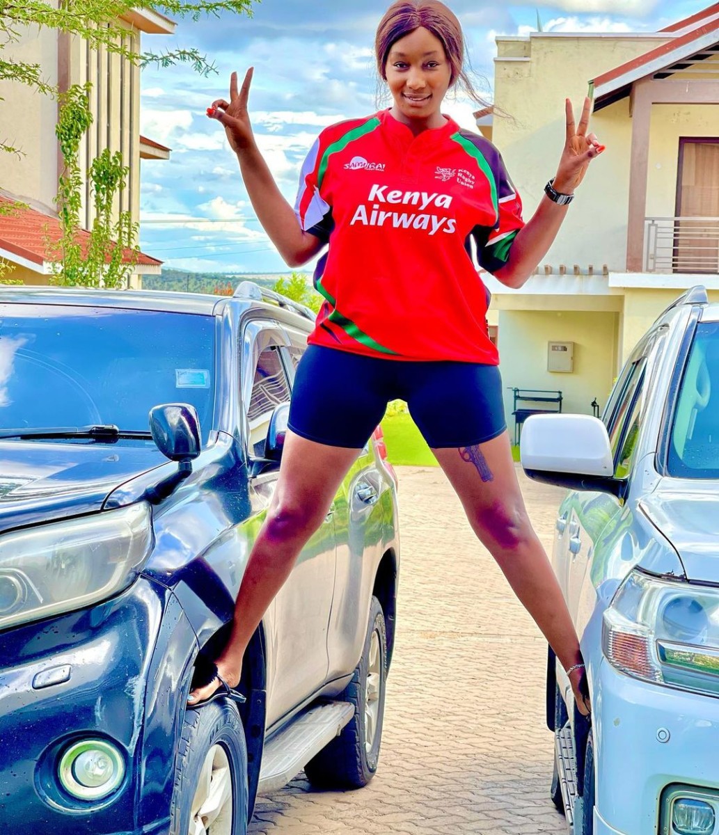 Shay Diva posing outside one of her mansions with her two cars. Photo credit: Instagram/shaydivaafrica