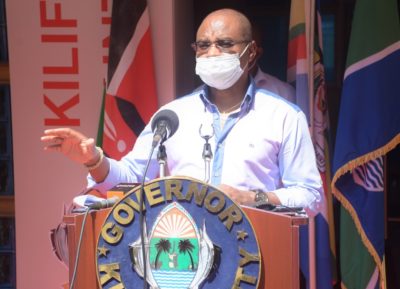 Octopizzo appreciates his mural drawn on a matatu