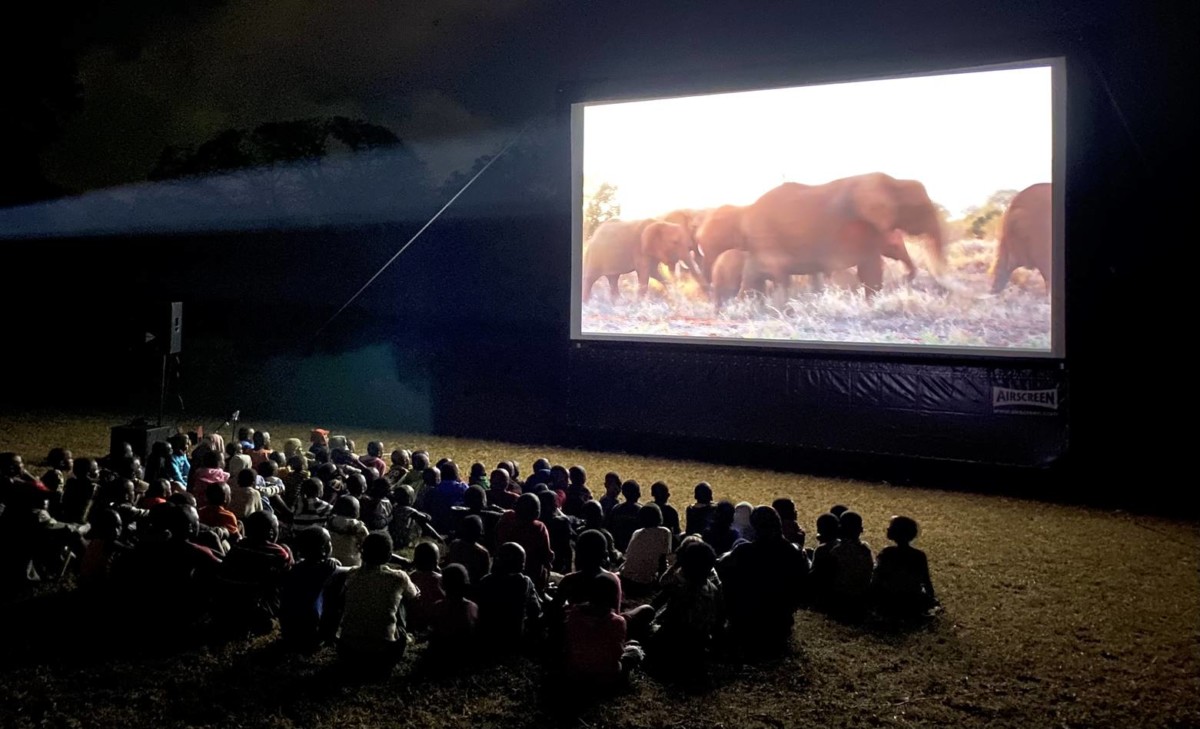 The Elephan Queen Mobile Cinema kids watching. Photo credit: ©Outreach & Education Ltd