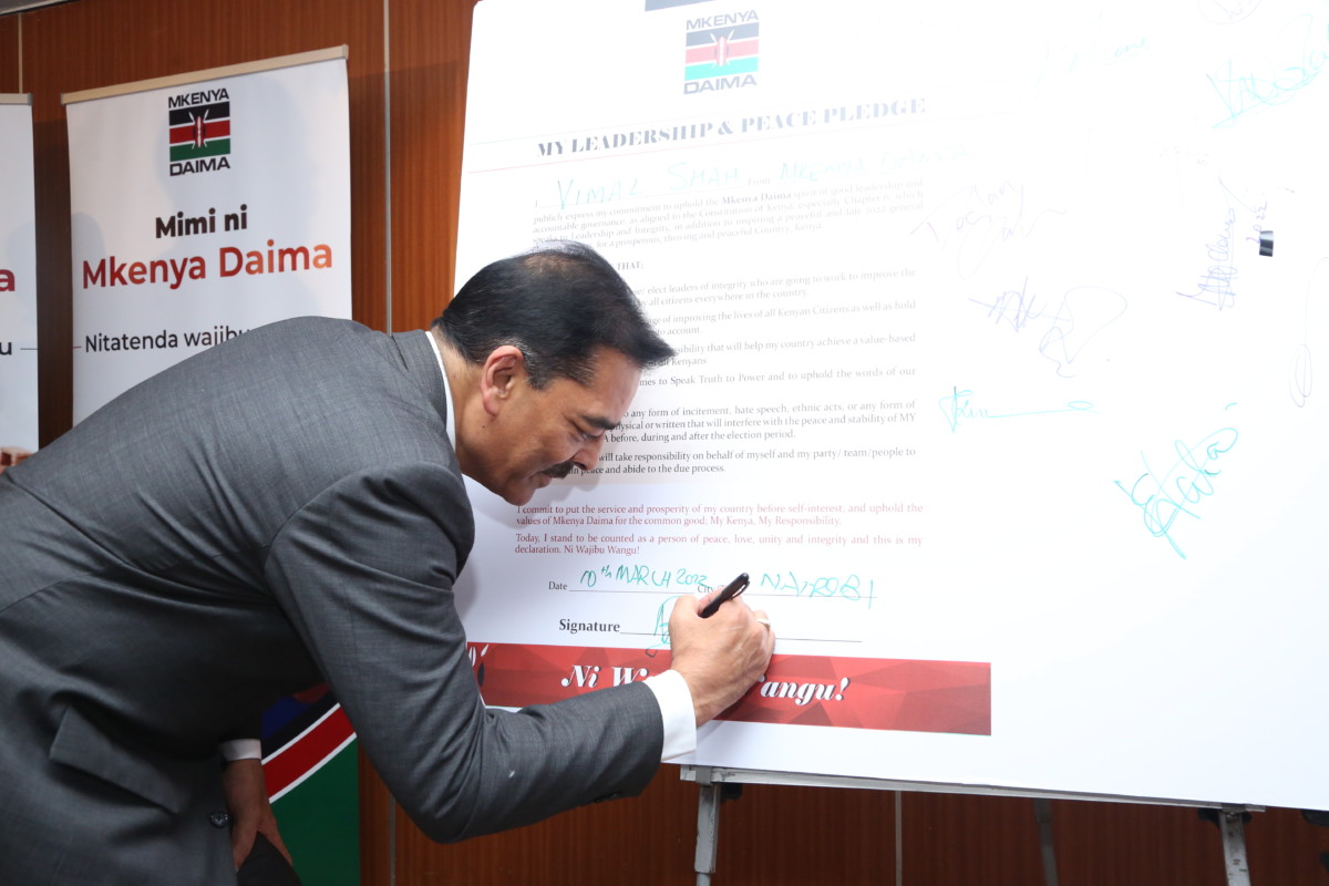 Vimal Shah, Chairperson Mkenya Daima Steering Committee, Signs the Leadership and Peace Pledge during the launch of the Mkenya Daima initiative 2022.