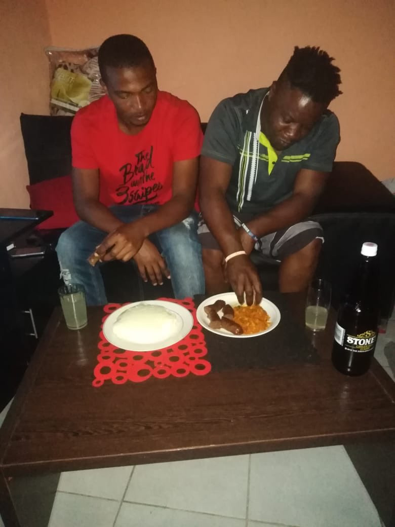 The Nigerian man and his best friend enjoying a meal together during good times. PHOTO/Courtesy.