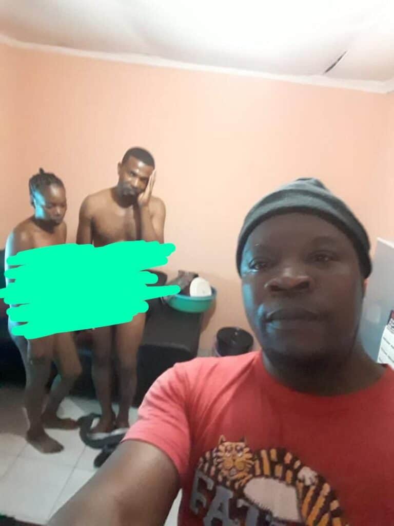 Nigerian man takes a selfie with his cheating wife and his best friend whom he caught red handed sleeping with his spouse. PHOTO/Courtesy.