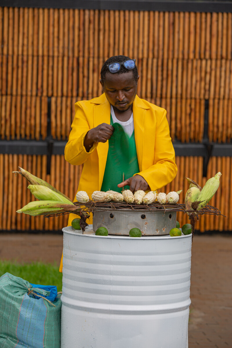 Benard Muriuki prepares his mahindi choma to ensure festival attendees have some to keep them warm due to the chilly weather.
