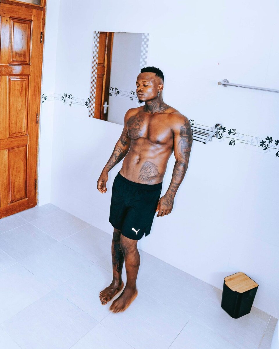 Harmonize who has many tattoos on his body shows off his fit body and his tats inside his home in Tanzania. Photo credit: Instagram/harmonize_tz