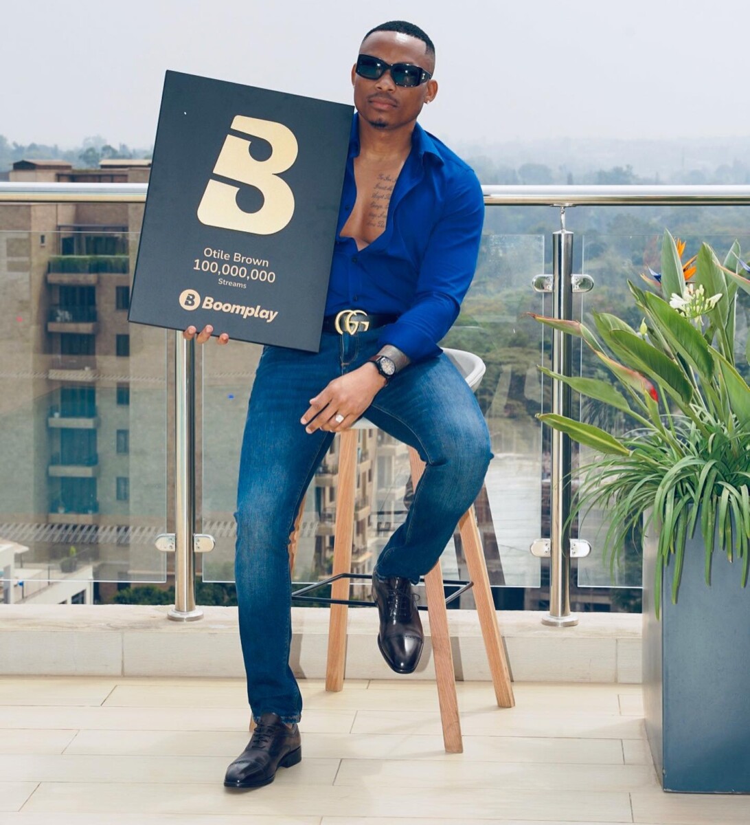 Otile Brown showing off his Boomplay plaques. Photo credit: Instagram/otilebrown