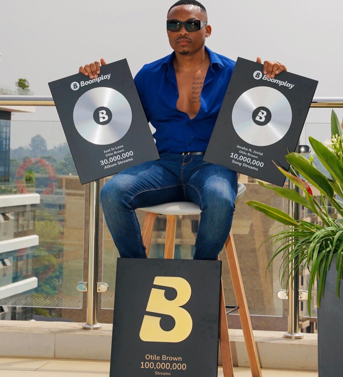 Otile Brown showing off his Boomplay plaques. Photo credit: Instagram/otilebrown