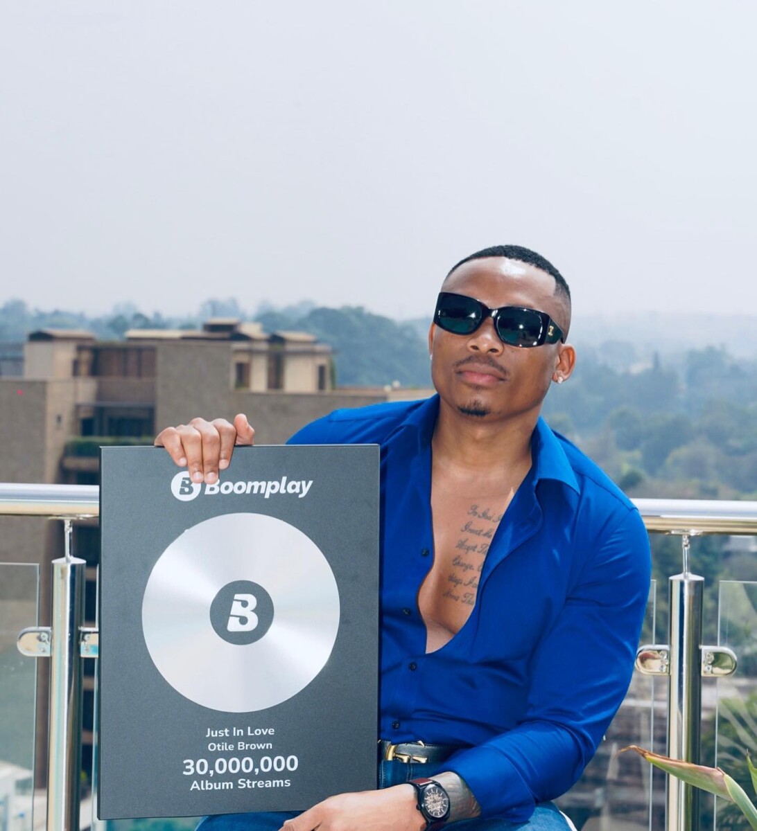 Otile Brown showing off his Boomplay plaques. Photo credit: Instagram/otilebrown