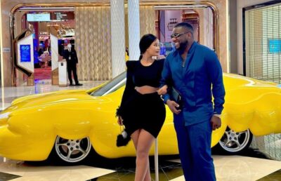 Kanye West walks barefoot in the streets as his wife steps out in nude catsuit 