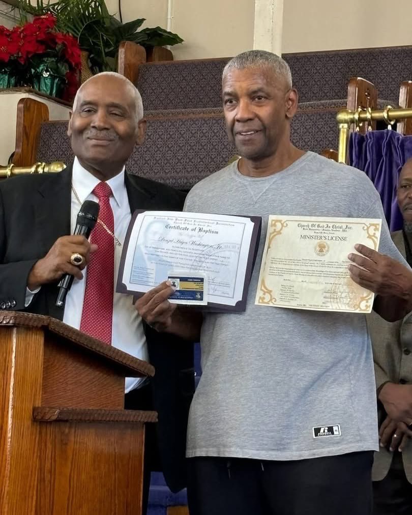 Denzel Washington holding up his Minister's License.📸: The First Jurisdiction Church of God/Facebook