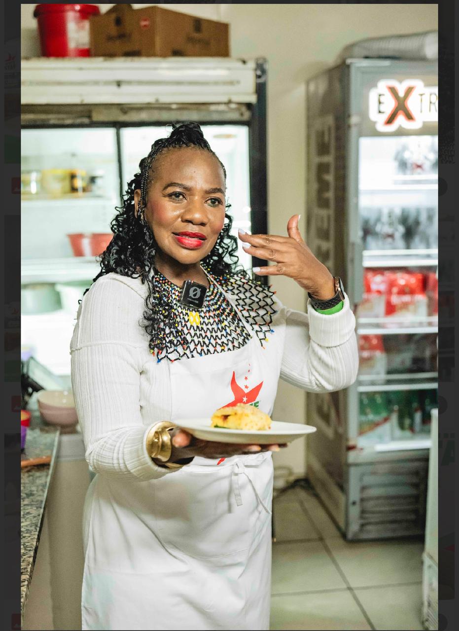 Singing Actress and revered cook Lucia Mthiyane serves up a plate of White Star pap at Exit Shisanyama and Carwash in Umlazi, Durban.