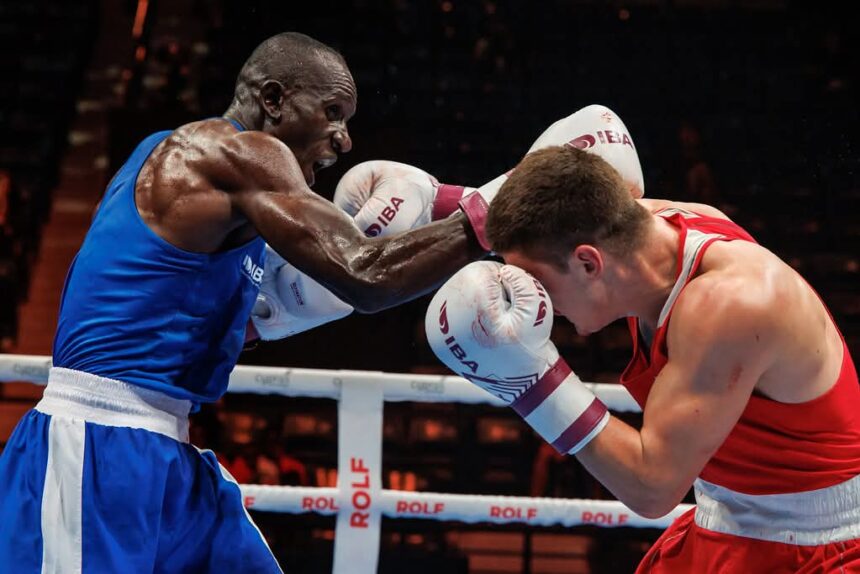 Edwin Okong’o lands a punch on Miroslav Kapuler Ishchenko during their high-tempo Dubai bout. PHOTO/IBA