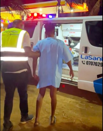 Eric Omondi is taken into an ambulance after suffering torn ligaments while trekking from Nairobi to Mombasa. 